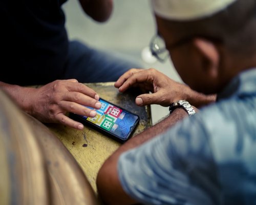Smartphone showing a fictional harbour cooperative game