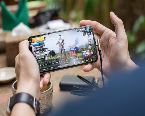 Smartphone showing a fictional creative arena game