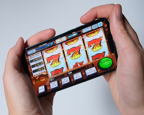 Smartphone showing a fictional neon puzzle game
